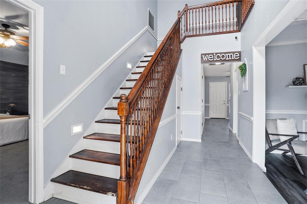 2613 Stone Hollow Drive Bedford, TX 76021 - Photo 6 of 33 a view of entryway and hall with wooden floor