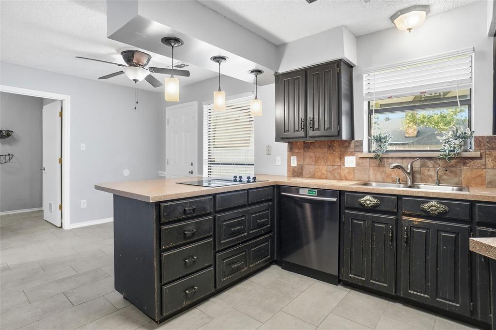 2613 Stone Hollow Drive Bedford, TX 76021 - Photo 8 of 33 a bathroom with a granite countertop sink double vanity and a mirror