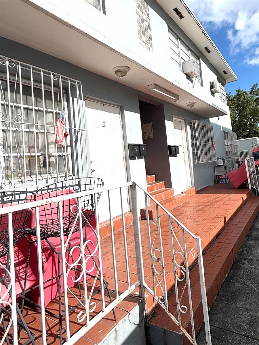 740 Southwest 7th Street, Unit 3 Miami, FL 33130 - Photo 8 of 10 a balcony with table and chairs