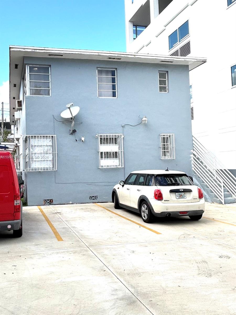 740 Southwest 7th Street, Unit 3 Miami, FL 33130 - Photo 9 of 10 a car parked in front of a house