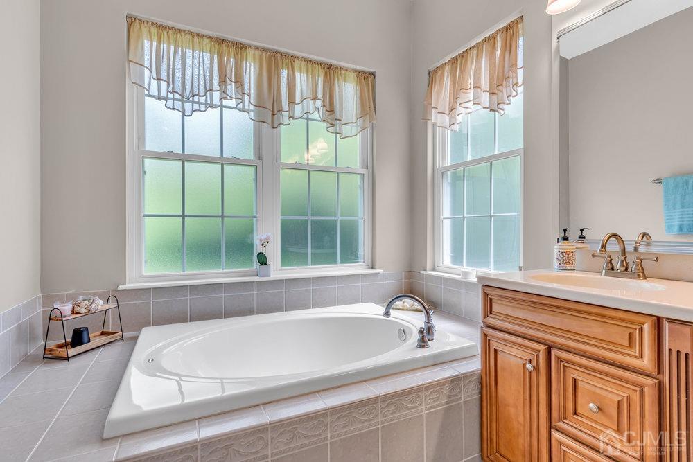 66 Kings Mill Road Monroe Township, NJ 08831 - Photo 38 of 56 a white bath tub sitting next to a window