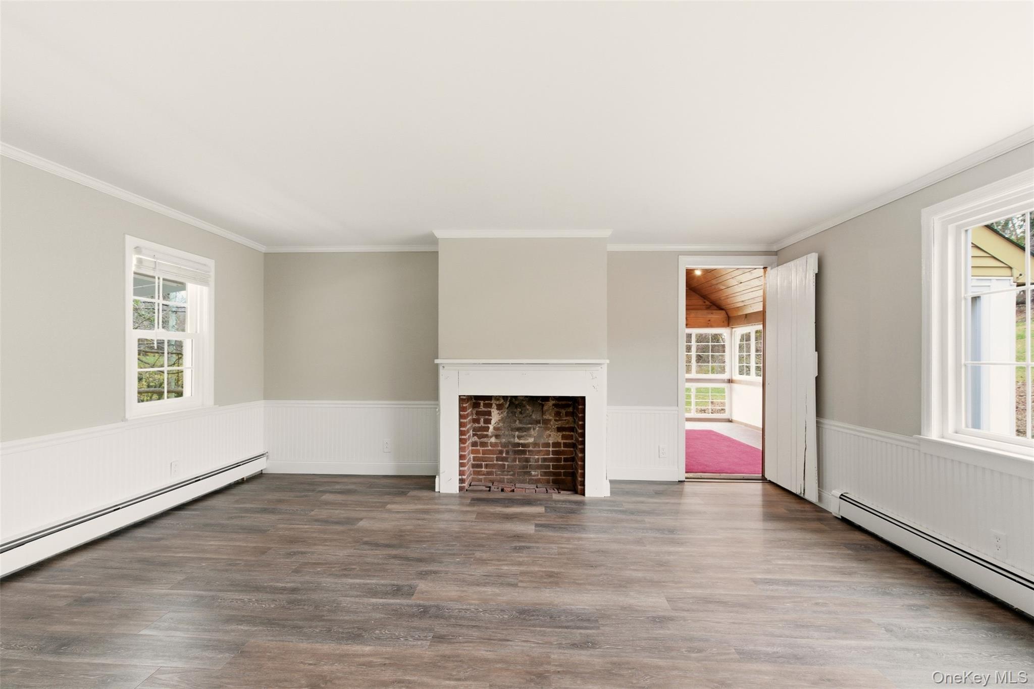 327 West Neck Road Lloyd Harbor, NY 11743 - Photo 5 of 24 an empty room with windows and fireplace