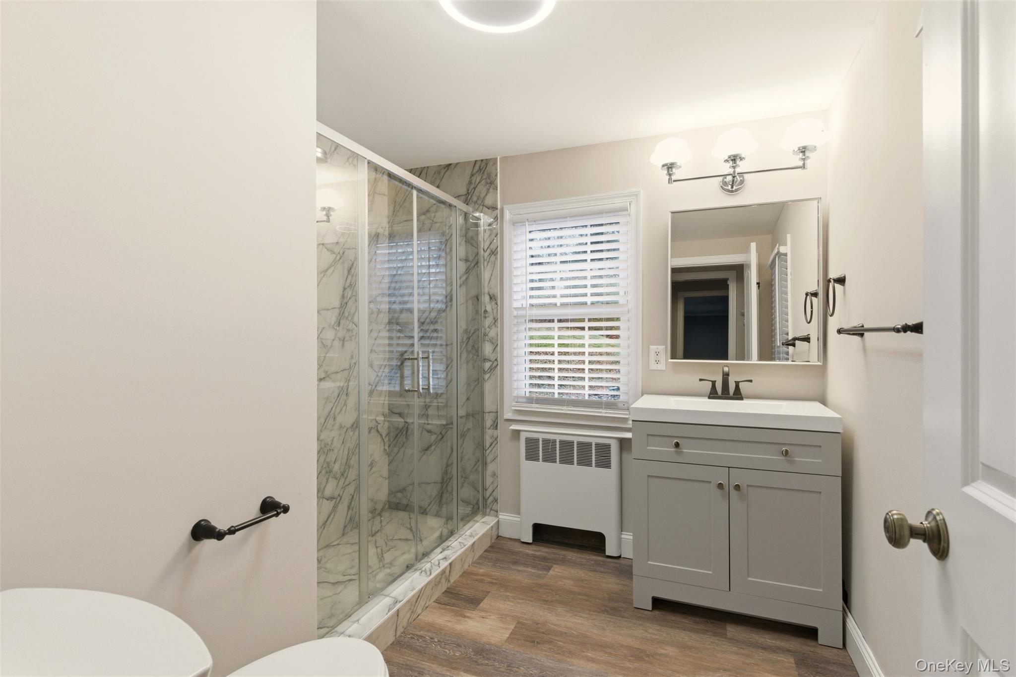 327 West Neck Road Lloyd Harbor, NY 11743 - Photo 7 of 24 a bathroom with a double vanity sink toilet and shower