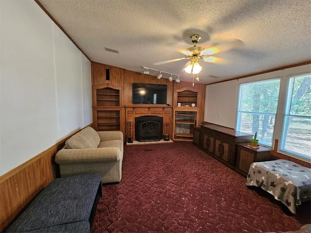 a view of hall way with furniture and a window