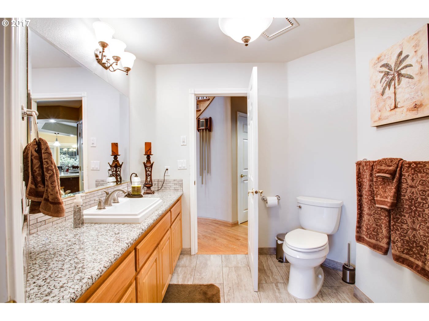 23401 Southeast Borges Road Damascus, OR 97089 - Photo 31 of 31 a bathroom with a granite countertop sink a toilet a mirror and shower