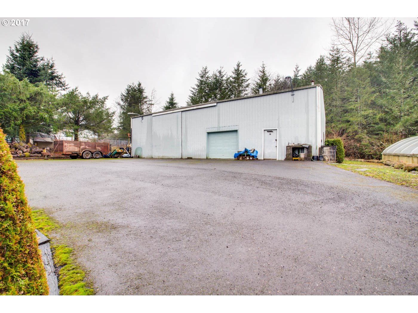 23401 Southeast Borges Road Damascus, OR 97089 - Photo 5 of 31 a view of a house with backyard and trees