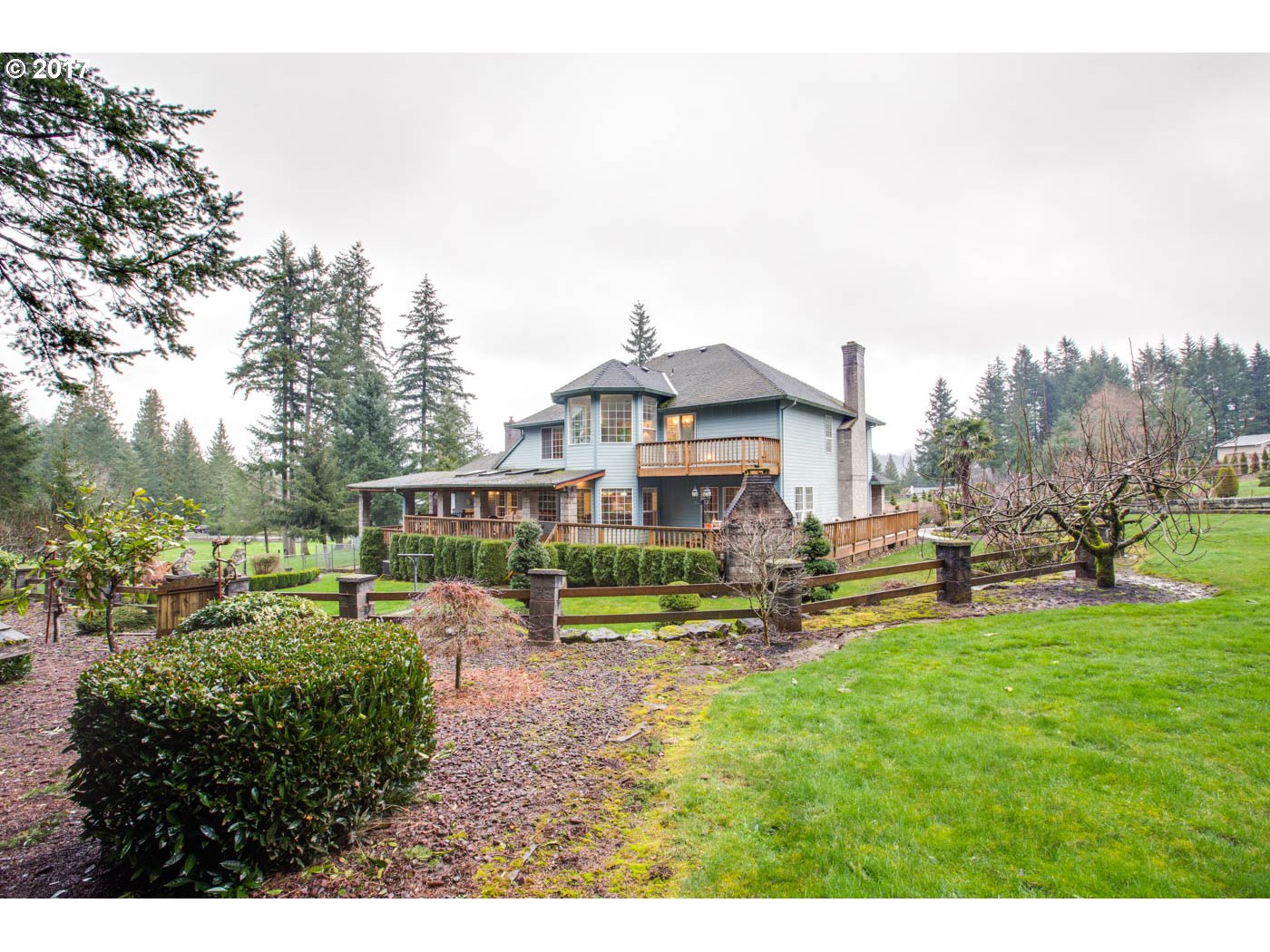 23401 Southeast Borges Road Damascus, OR 97089 - Photo 8 of 31 a view of a house with a yard porch and sitting area