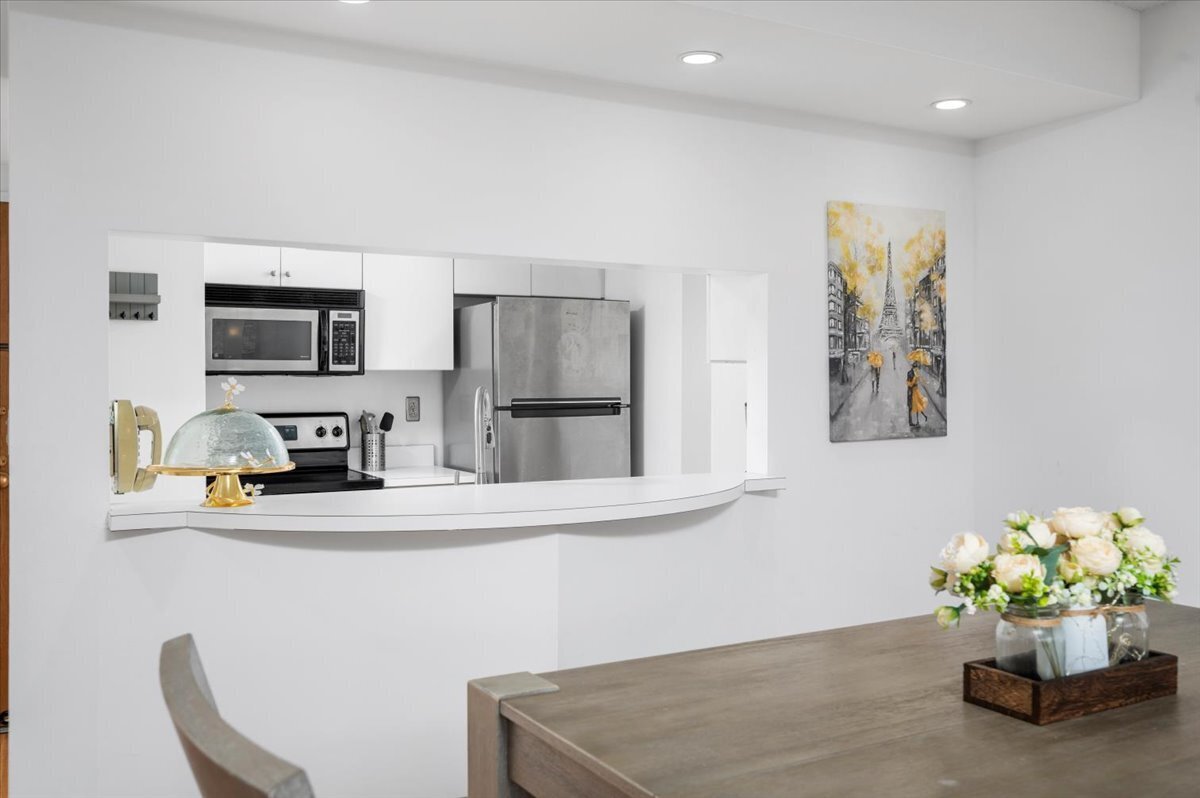 127 Greyrock Place, Unit 810 Stamford, CT 06901 - Photo 11 of 34 a kitchen with stainless steel appliances a microwave refrigerator and a microwave