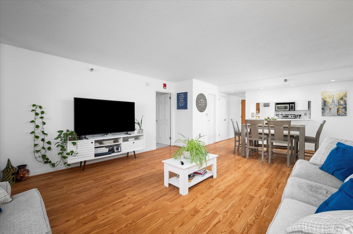 127 Greyrock Place, Unit 810 Stamford, CT 06901 - Photo 4 of 34 a living room with furniture and a flat screen tv