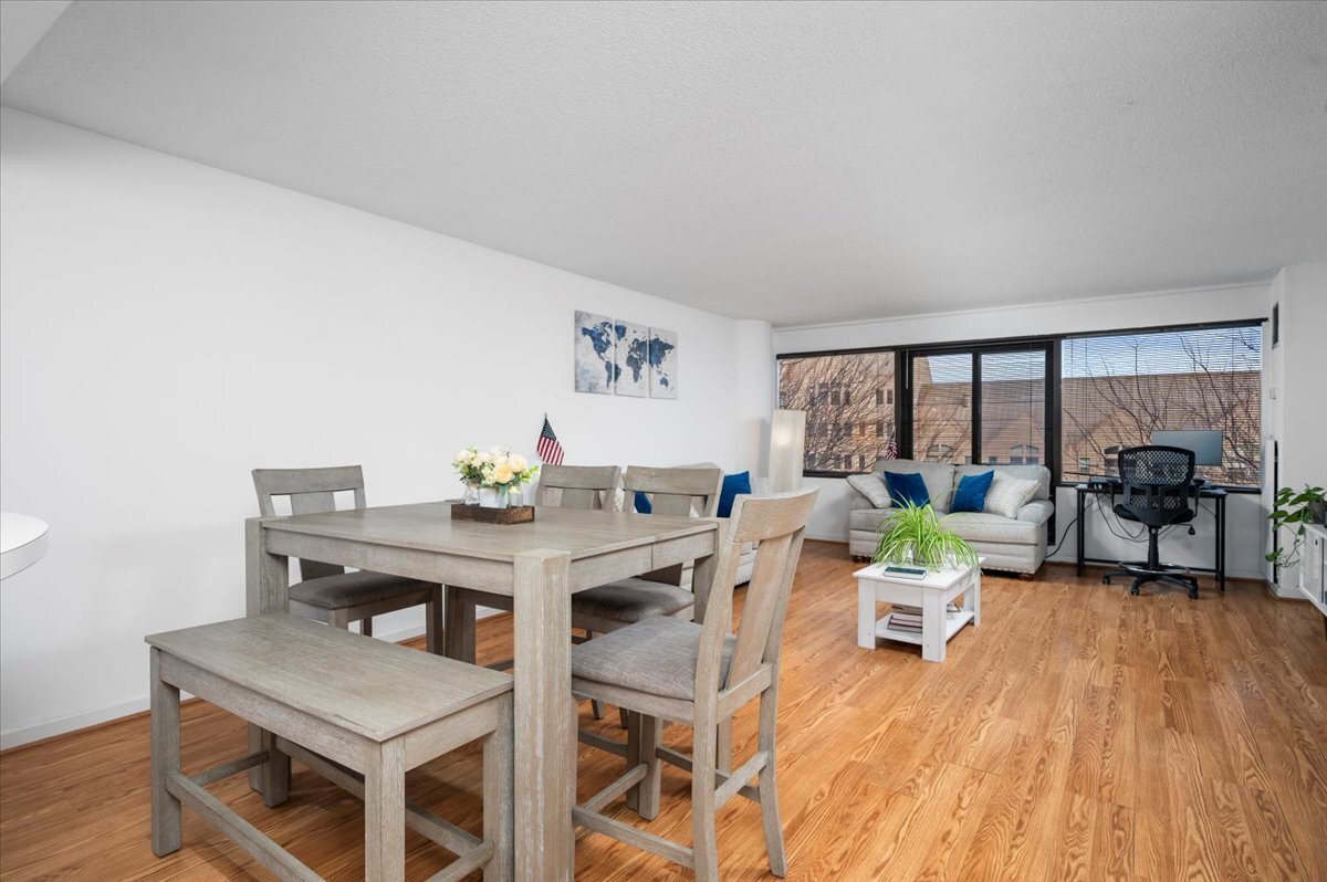 127 Greyrock Place, Unit 810 Stamford, CT 06901 - Photo 7 of 34 a workspace with furniture and a wooden floor