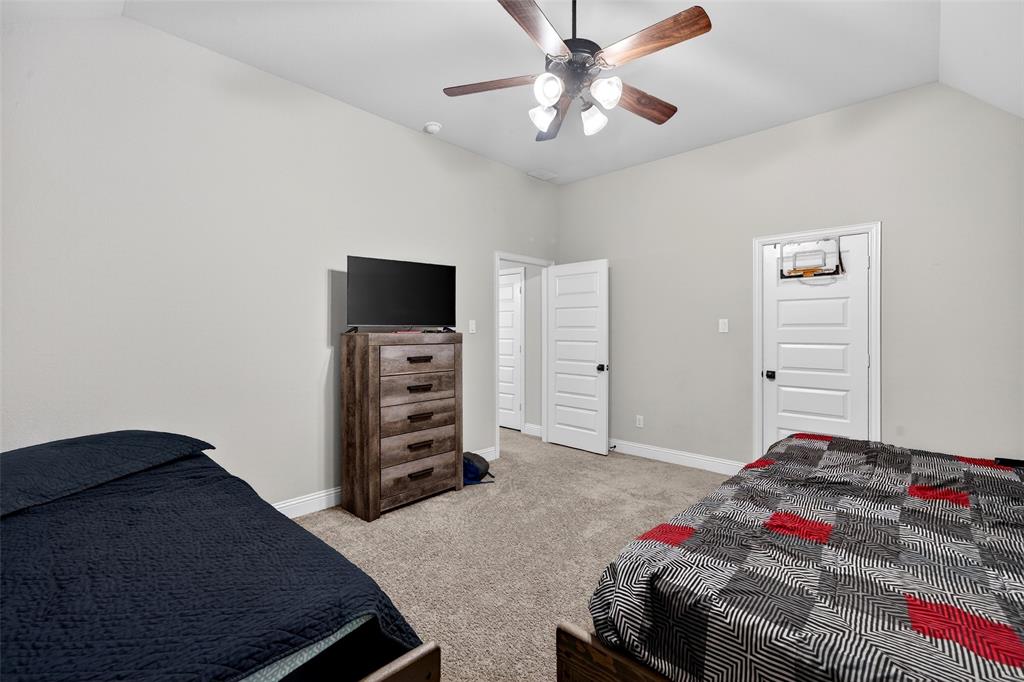 3245 Ribisl Lane Royse City, TX 75189 - Photo 25 of 39 a bedroom with a bed and a television