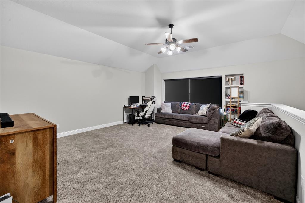 3245 Ribisl Lane Royse City, TX 75189 - Photo 27 of 39 a living room with furniture and a flat screen tv