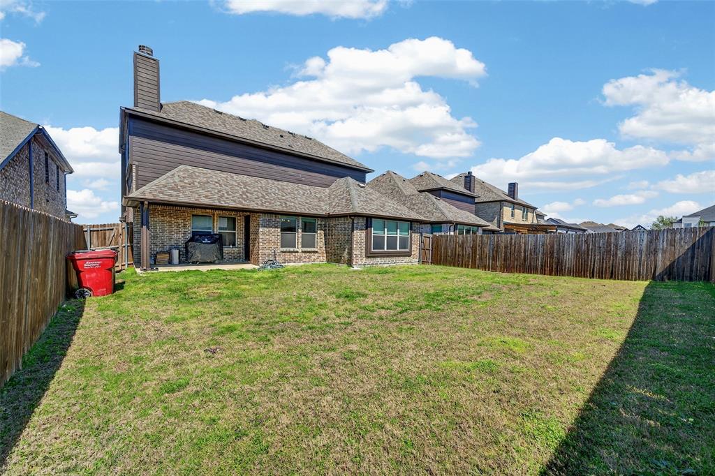 3245 Ribisl Lane Royse City, TX 75189 - Photo 30 of 39 a front view of a house with yard