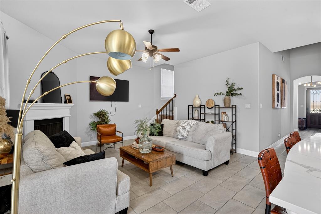3245 Ribisl Lane Royse City, TX 75189 - Photo 6 of 39 a living room with furniture chandelier and a mirror