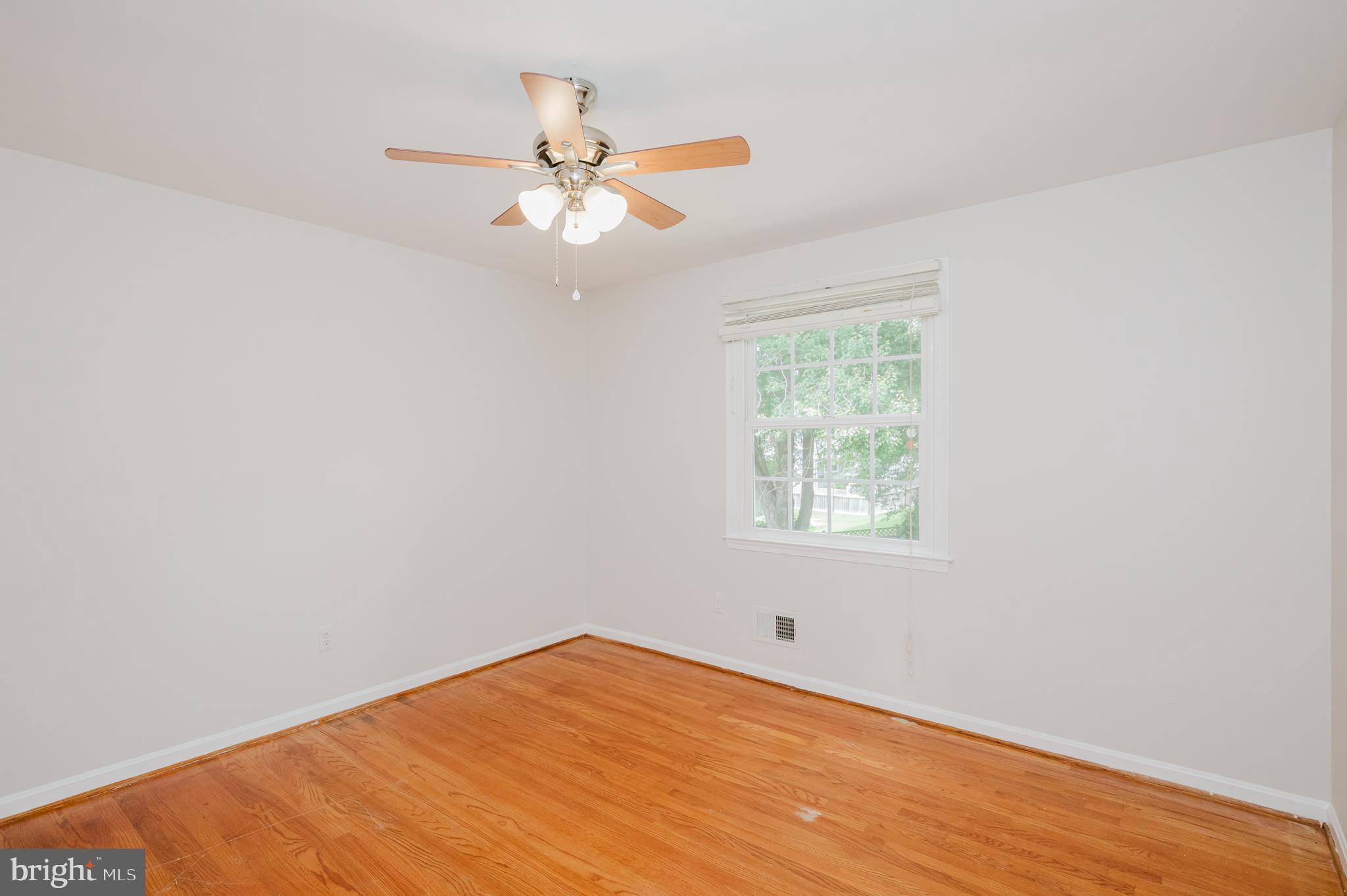 4 Old Spring Court Cockeysville, MD 21030 - Photo 42 of 53 an empty room with a window and a fan