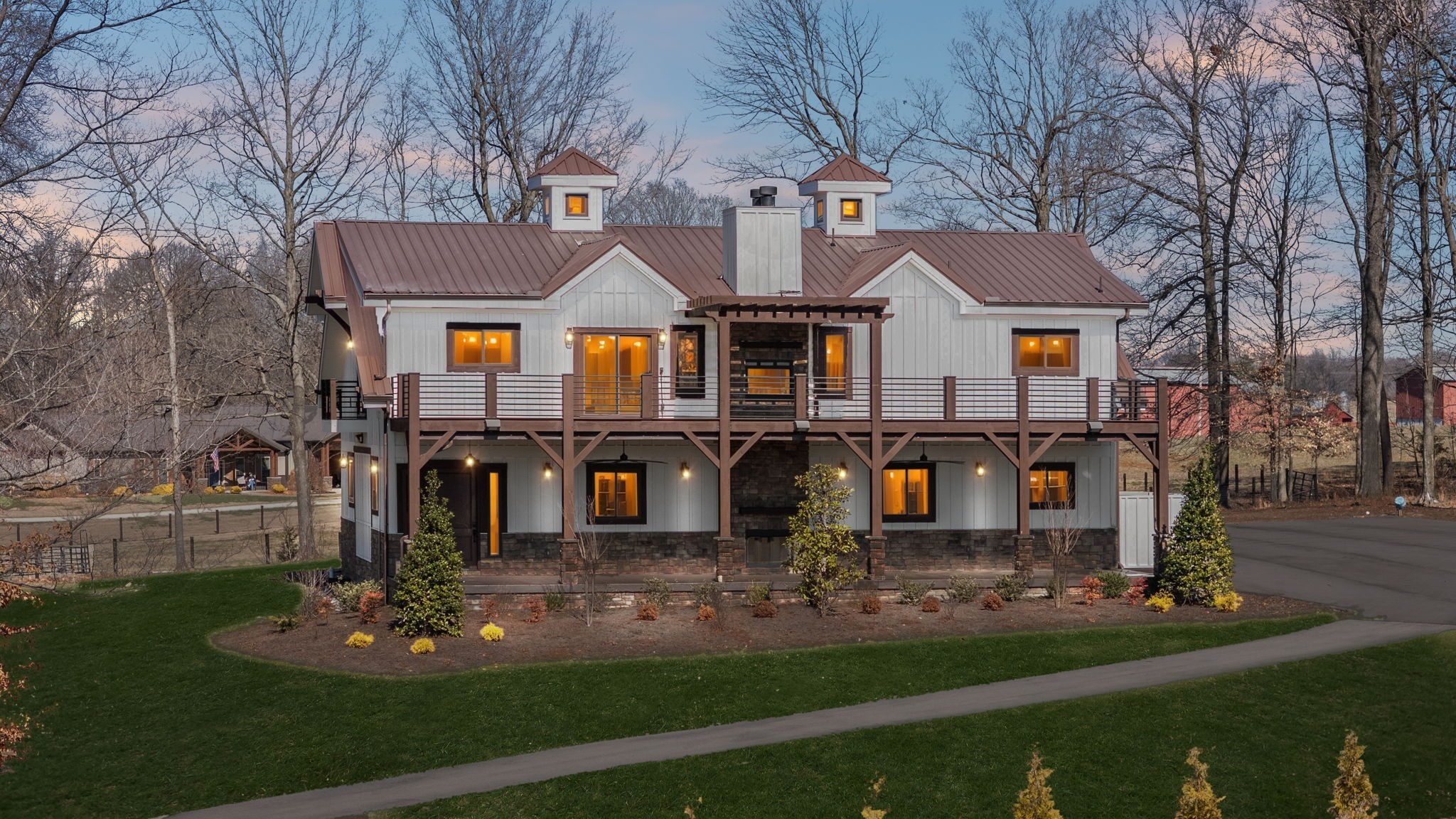 a front view of house with yard and green space