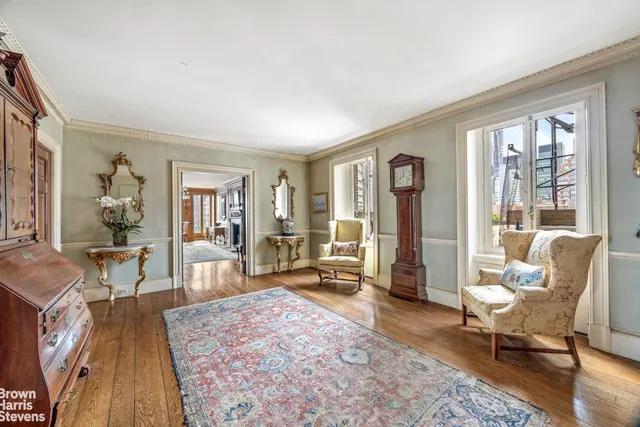 a view of a livingroom with furniture window and wooden floor
