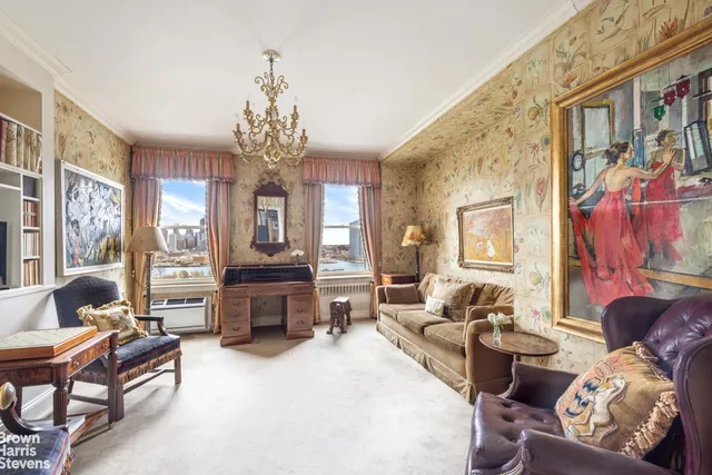 a kitchen with a stove a table and chairs in it