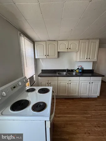 a kitchen with a stove and a refrigerator
