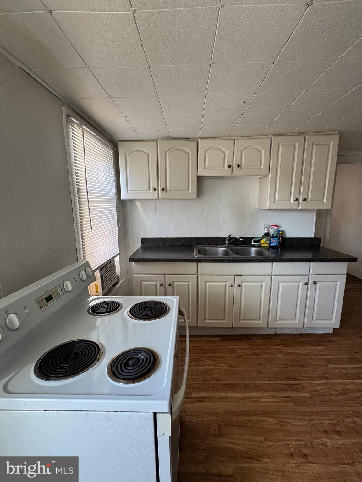 a kitchen with a stove and a refrigerator