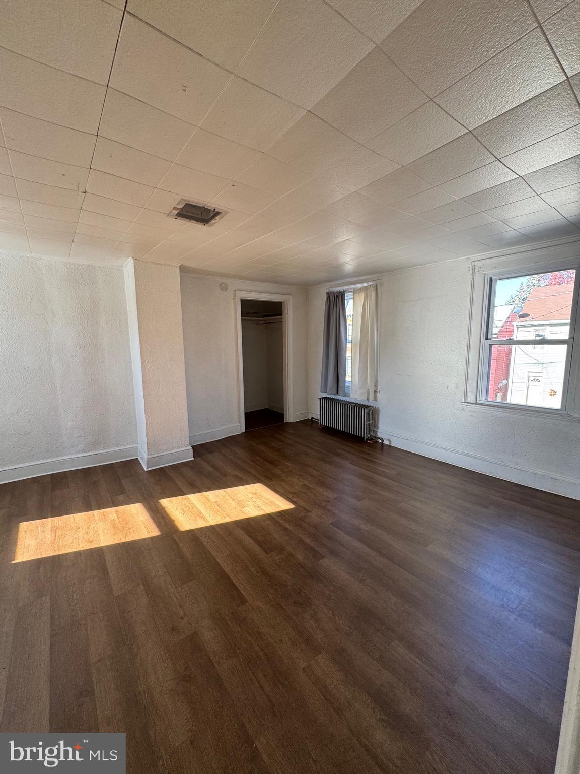 336 Cherry Street, Unit 2 Columbia, PA 17512 - Photo 2 of 8 a view of empty room with wooden floor and fan