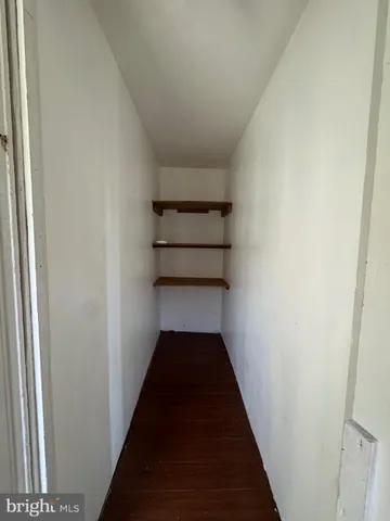 a view of a hallway with a stairs