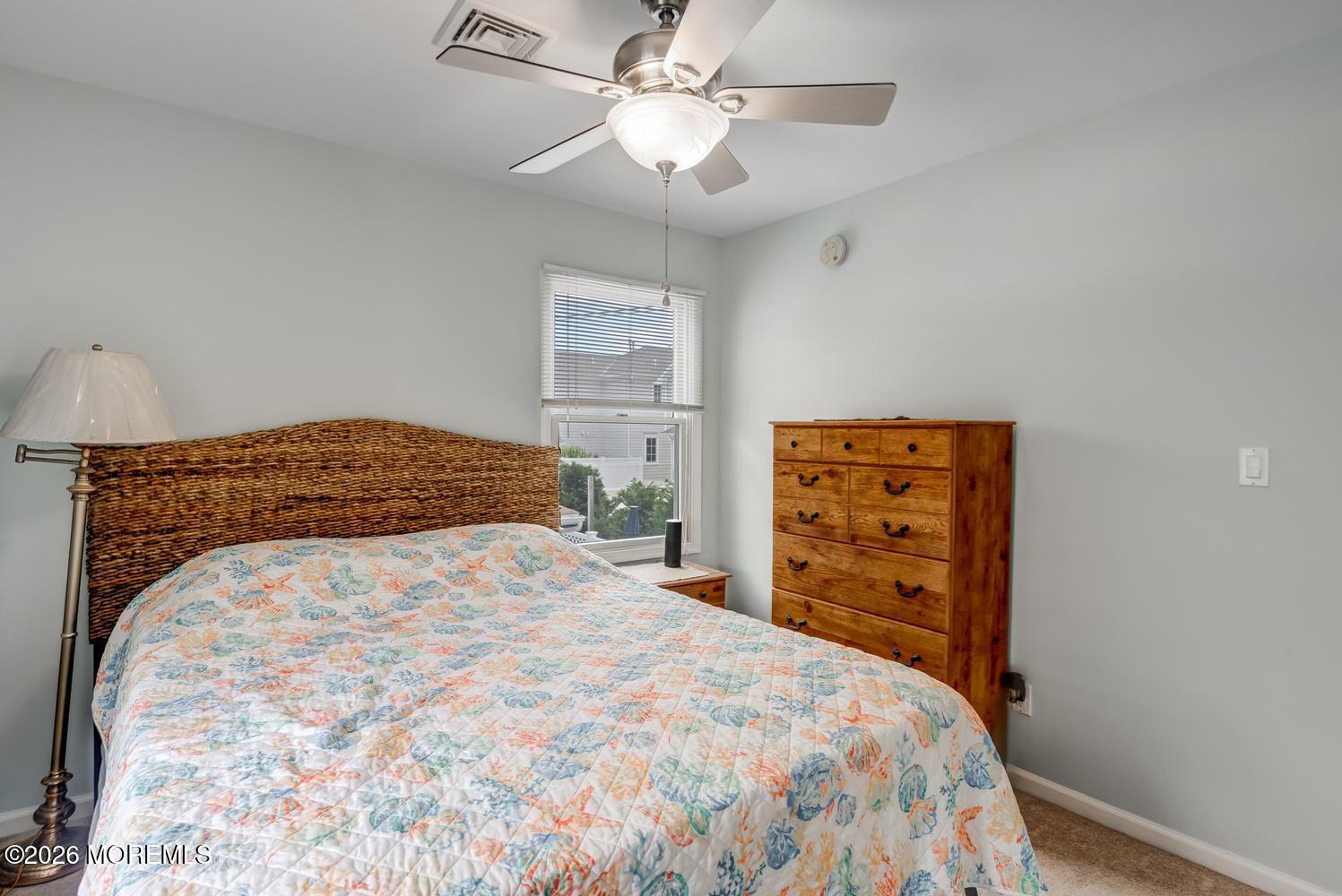 19 Shore Way Lavallette, NJ 08735 - Photo 20 of 38 a bedroom with a bed and a dresser