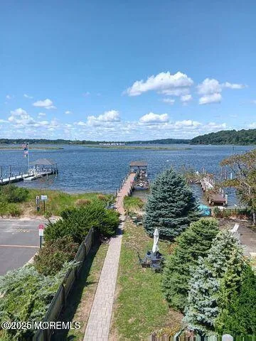 a view of a lake with a yard