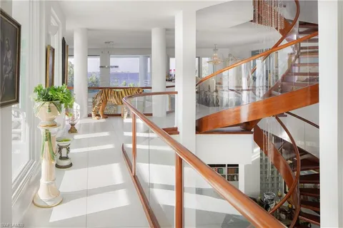 a view of a balcony with lake view and a floor to ceiling window