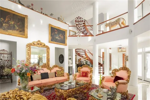 a view of a hallway with furniture and entryway