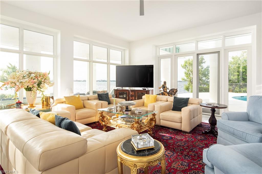 14040 Schultz Road Fort Myers, FL 33908 - Photo 22 of 47 a living room with furniture and a large window