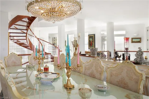 a view of house with swimming pool yard and outdoor seating