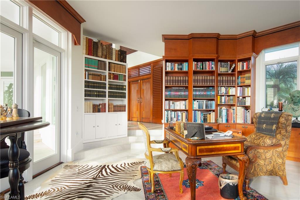 14040 Schultz Road Fort Myers, FL 33908 - Photo 26 of 47 a view of a bedroom with a bed and wooden floor