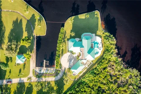 a swimming pool with outdoor seating and yard