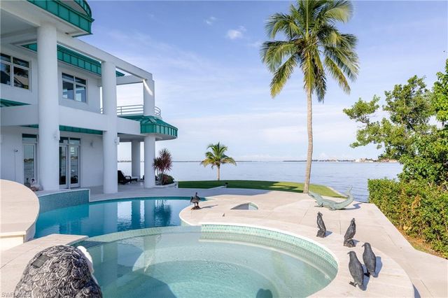 a view of a swimming pool with an ocean view