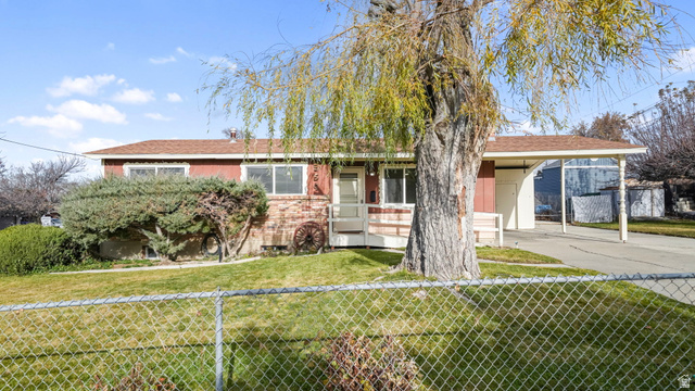 359 East 8400th Street South Sandy, UT 84070 - Photo 24 of 35 Ranch-style home featuring covered porch, brick siding, a carport, and driveway