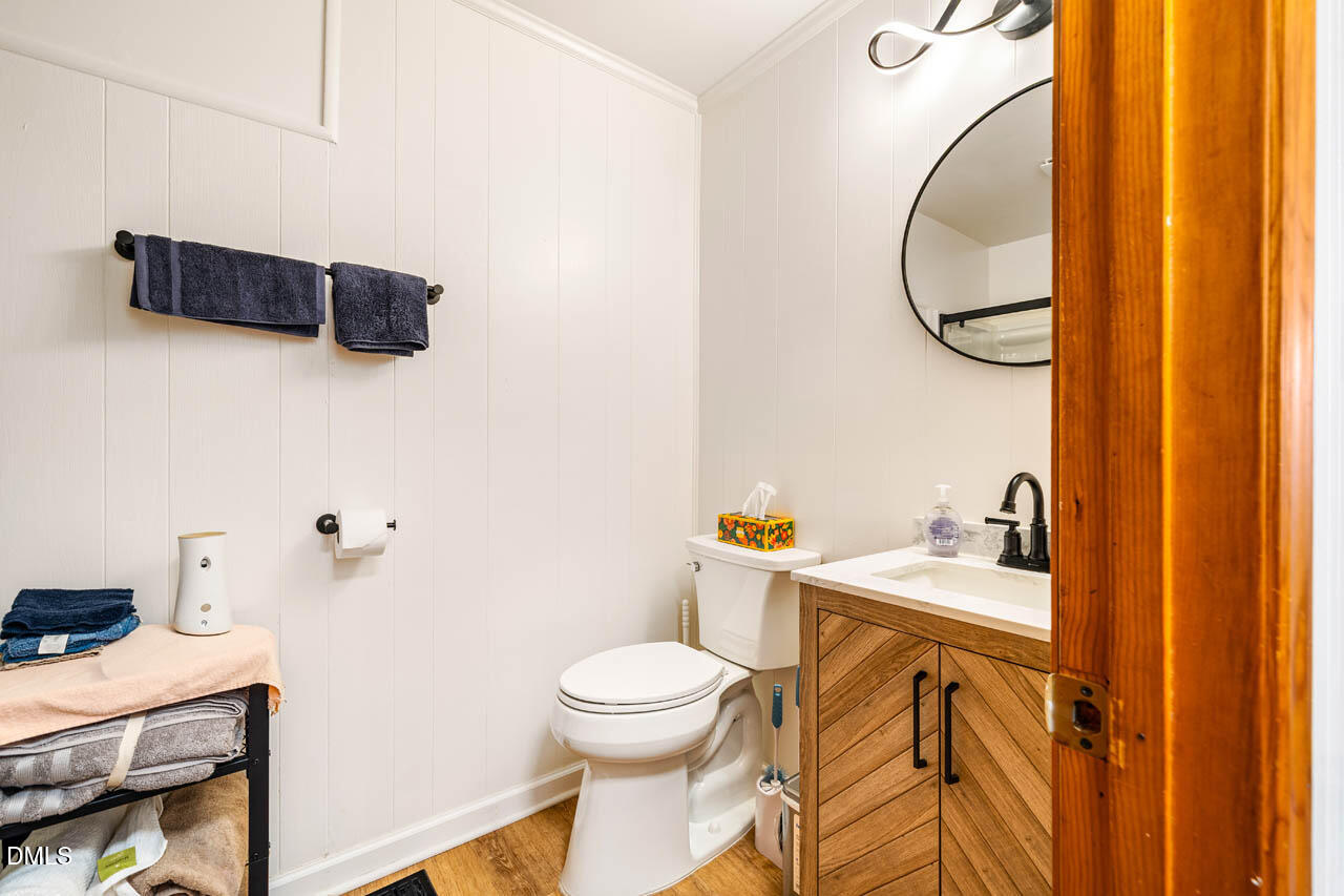 200 Sawmill Road Cedar Grove, NC 27231 - Photo 16 of 72 a bathroom with a sink a toilet and a mirror