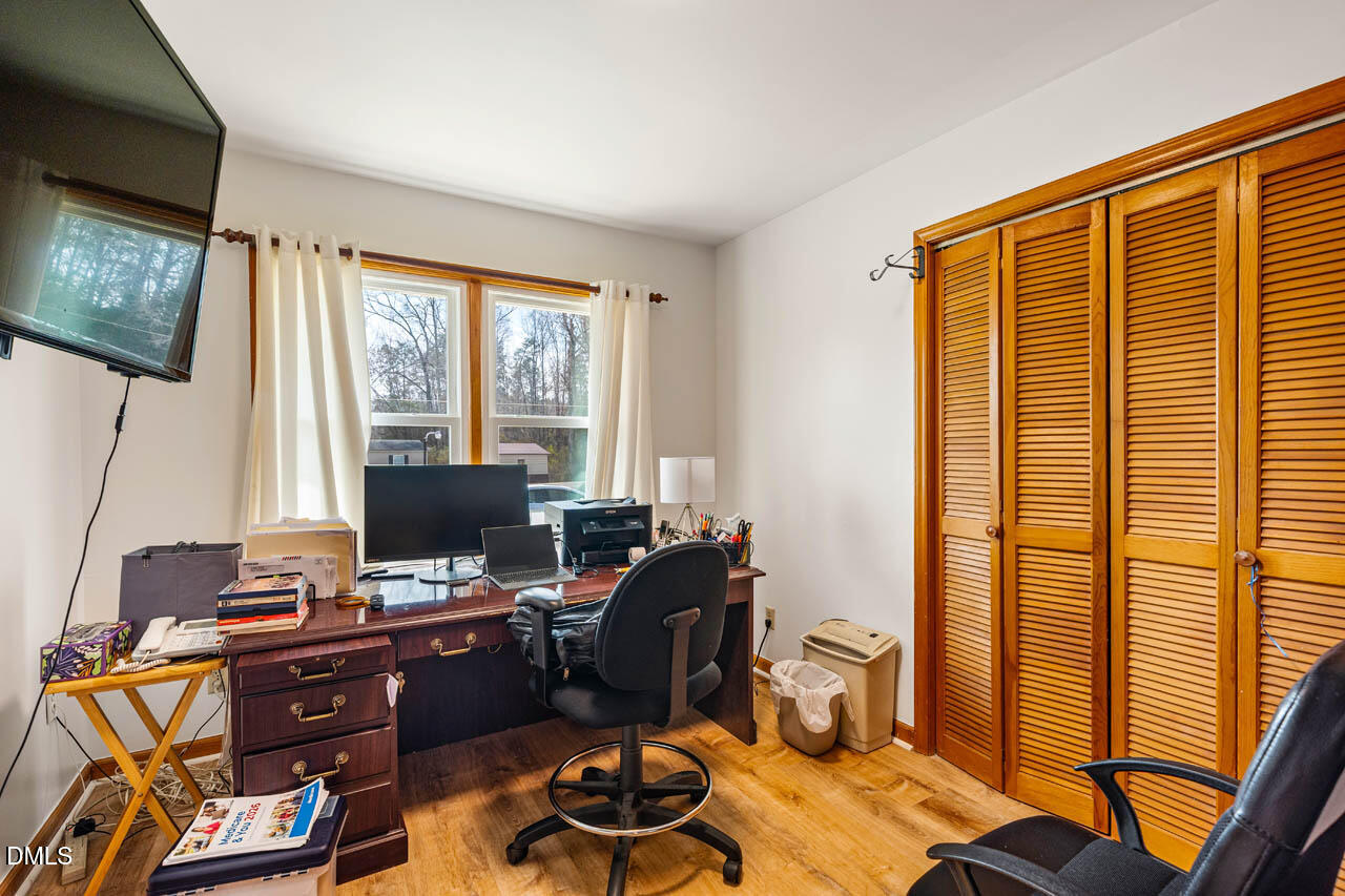 200 Sawmill Road Cedar Grove, NC 27231 - Photo 18 of 72 a view of a workspace with furniture and a window