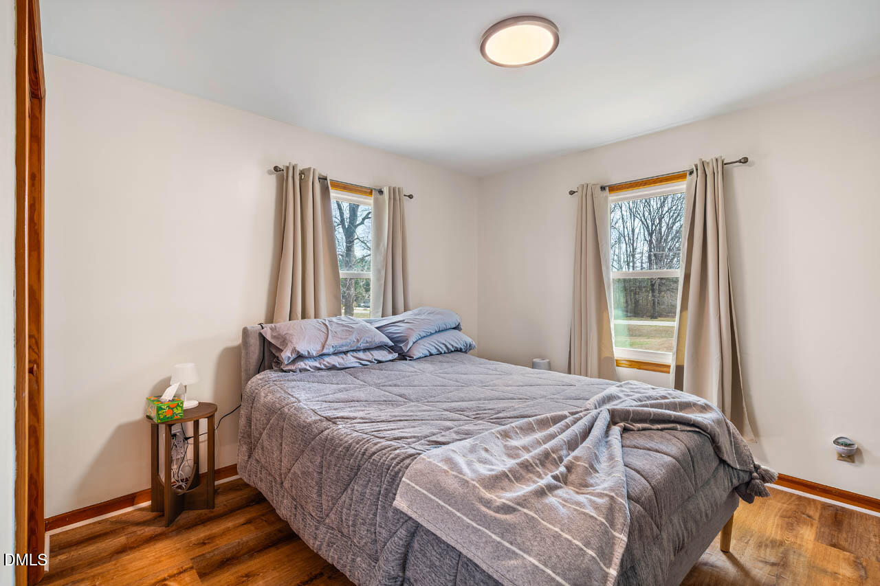 200 Sawmill Road Cedar Grove, NC 27231 - Photo 19 of 72 a bedroom with a bed and a window