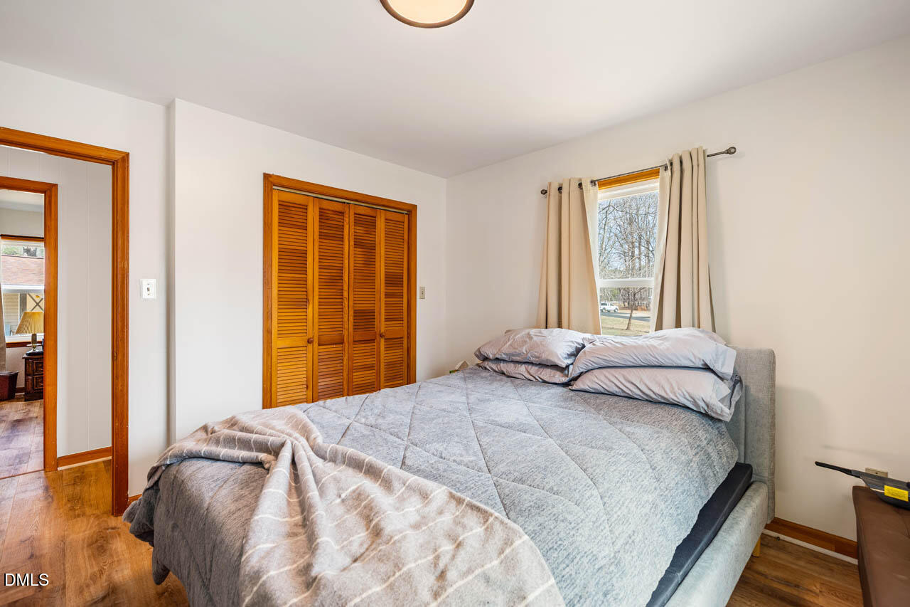 200 Sawmill Road Cedar Grove, NC 27231 - Photo 20 of 72 a bedroom with a bed and a window