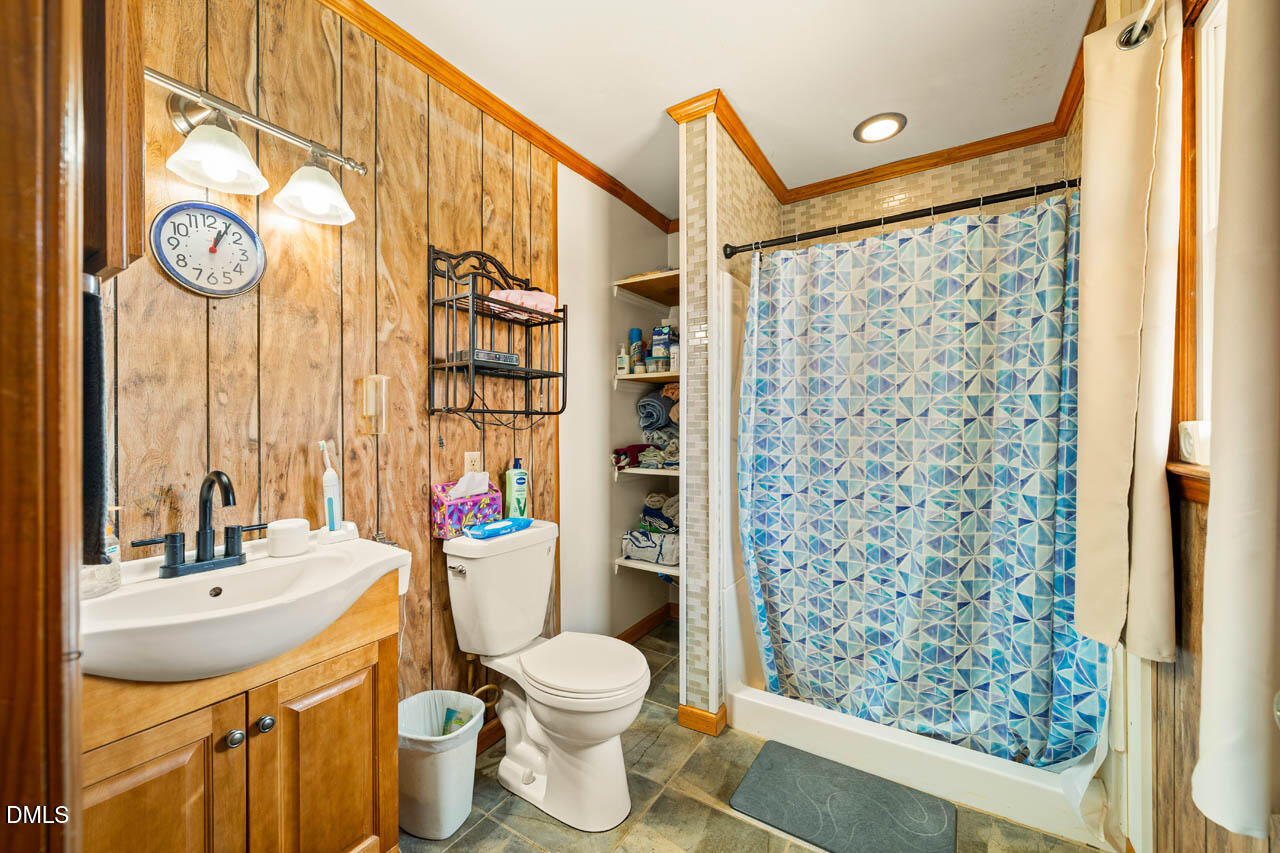 200 Sawmill Road Cedar Grove, NC 27231 - Photo 23 of 72 a bathroom with a sink toilet and shower