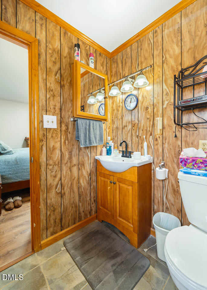 200 Sawmill Road Cedar Grove, NC 27231 - Photo 24 of 72 a bathroom with a granite countertop sink and a shower curtain