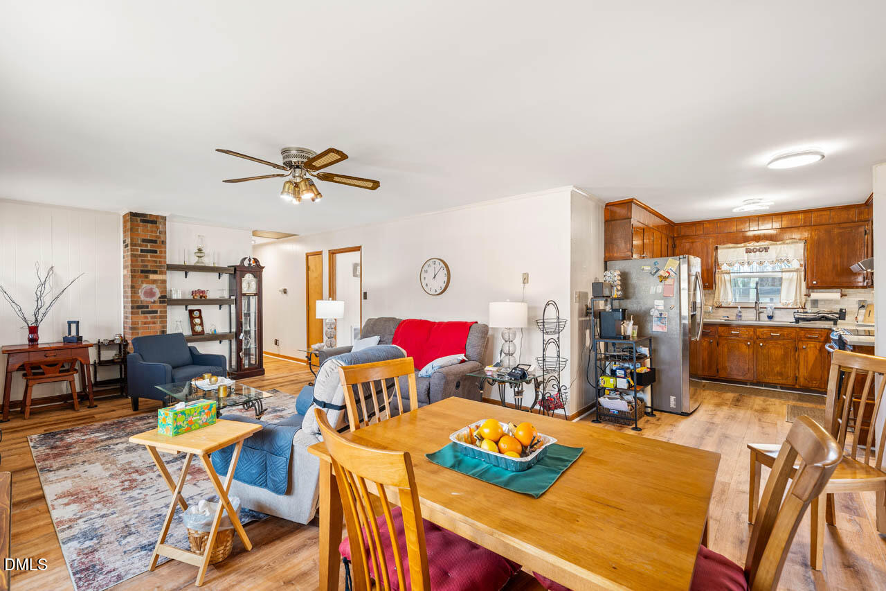 200 Sawmill Road Cedar Grove, NC 27231 - Photo 26 of 72 a living room with furniture kitchen view and a dining table