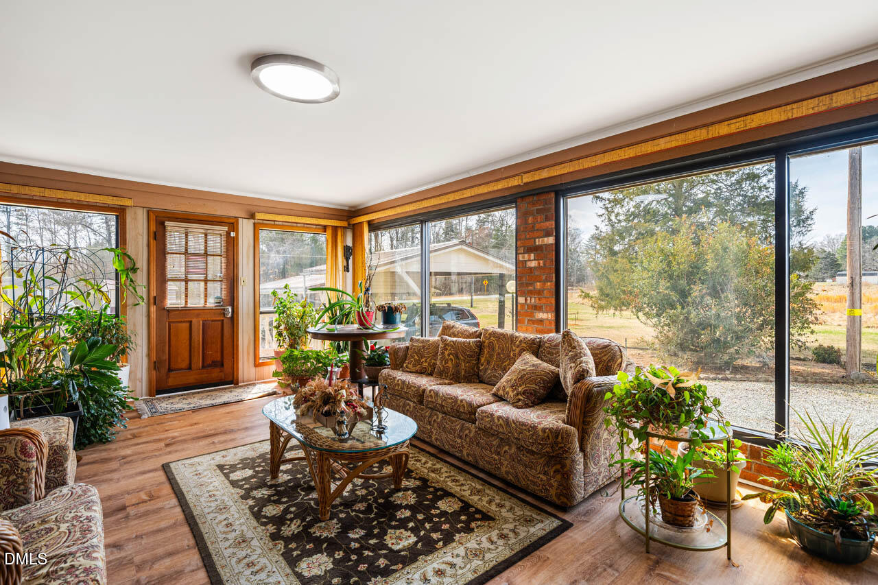 200 Sawmill Road Cedar Grove, NC 27231 - Photo 3 of 72 a living room with furniture and a large window