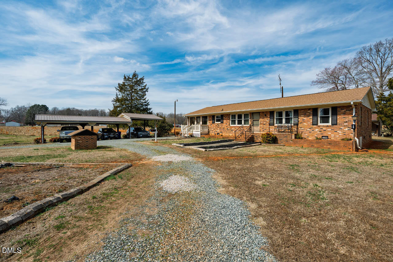 200 Sawmill Road Cedar Grove, NC 27231 - Photo 32 of 72 a view of house with outdoor space and car parked
