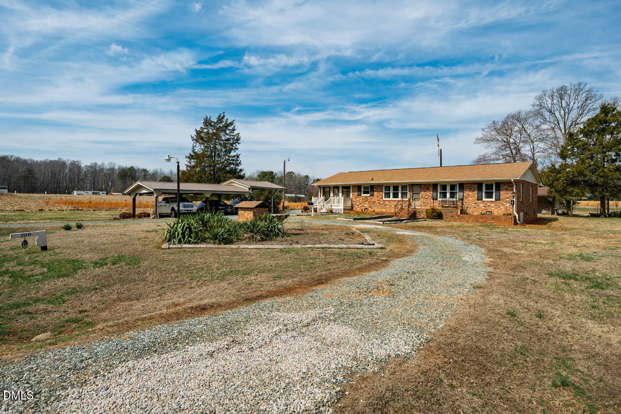 200 Sawmill Road Cedar Grove, NC 27231 - Photo 33 of 72 a view of a town with big yard and large trees