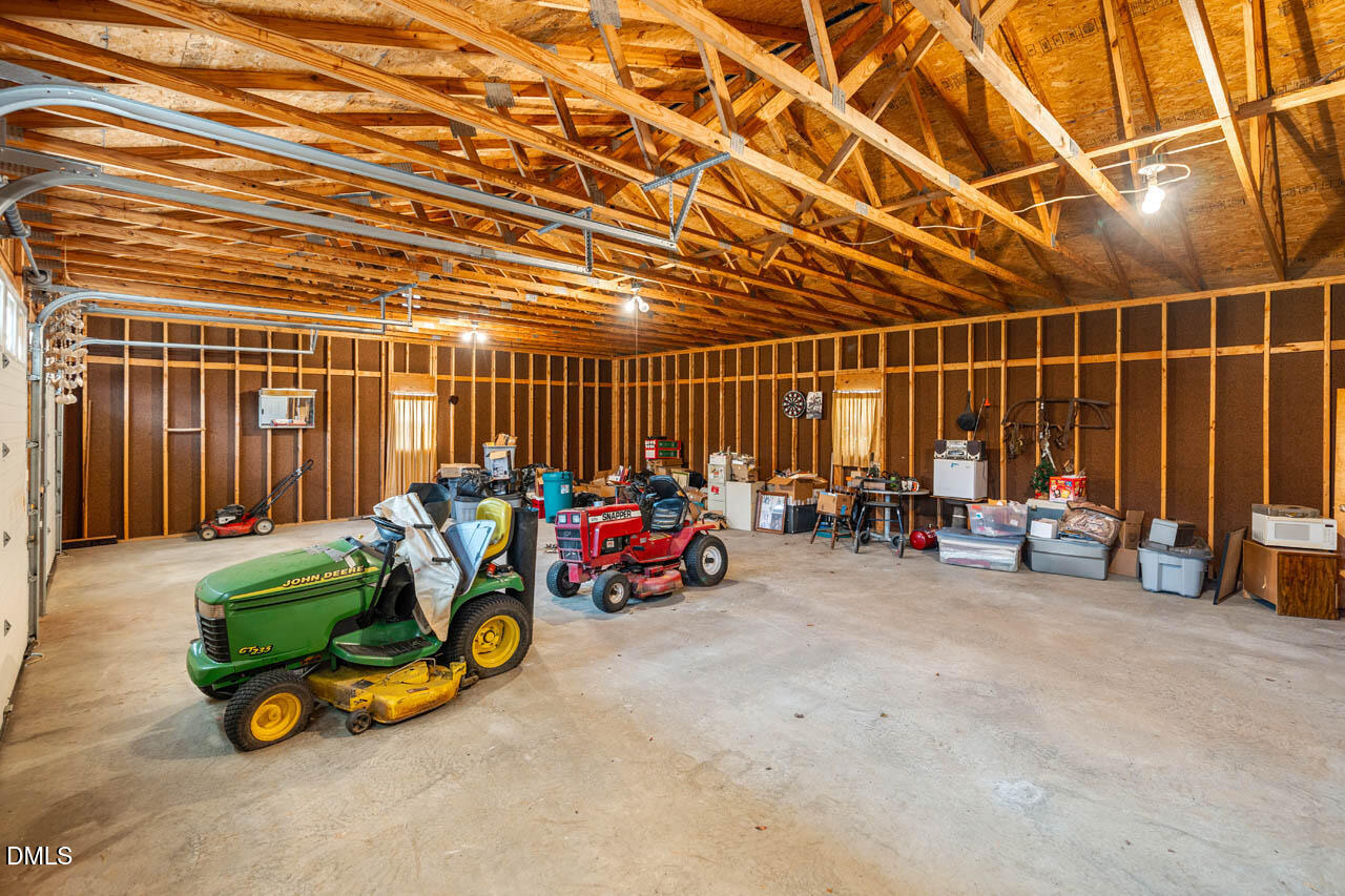200 Sawmill Road Cedar Grove, NC 27231 - Photo 38 of 72 a view of a garage with a table and chairs
