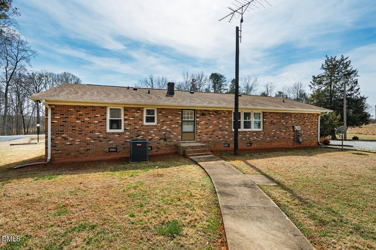 200 Sawmill Road Cedar Grove, NC 27231 - Photo 42 of 72 a view of house with a big yard