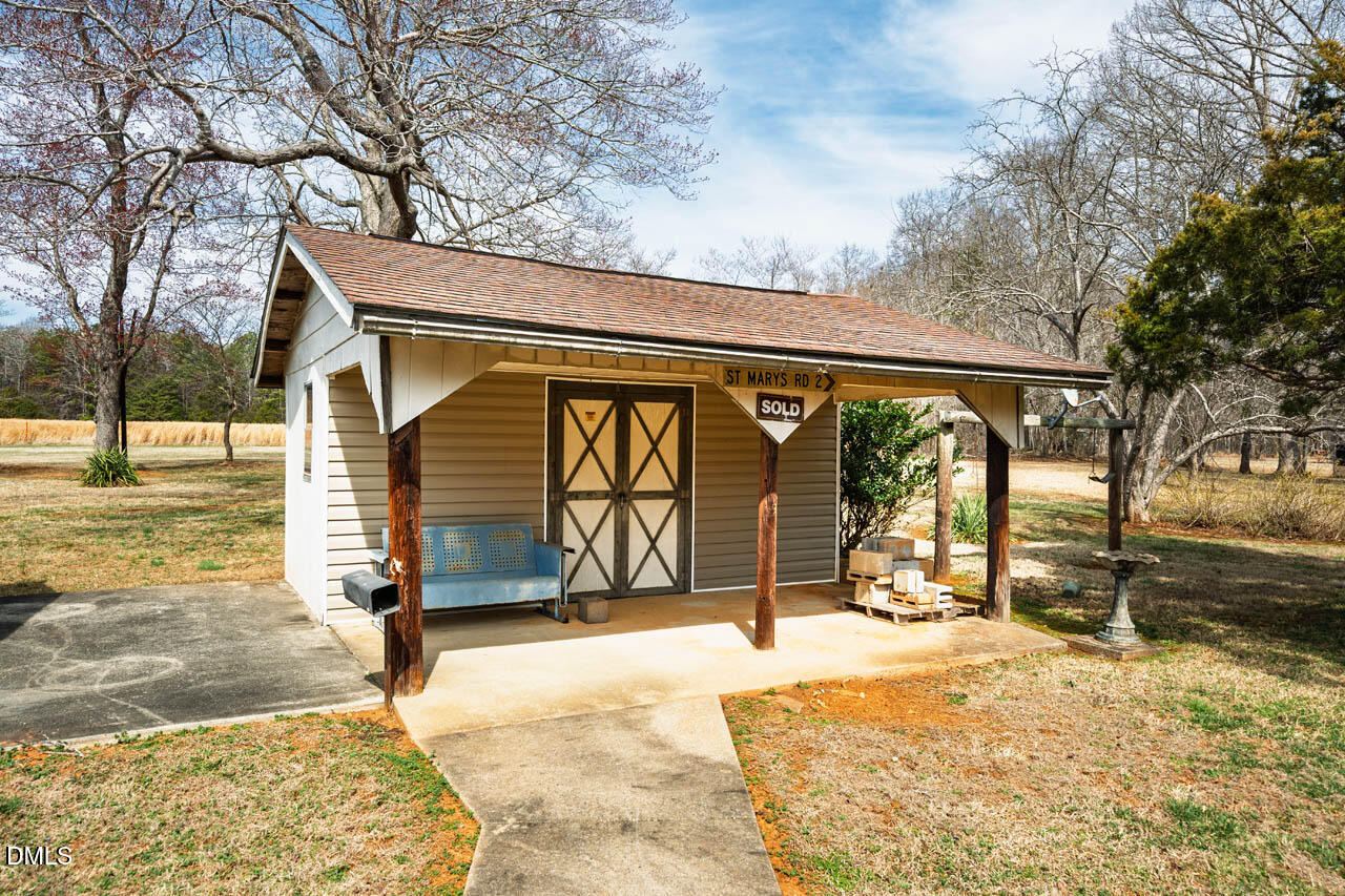 200 Sawmill Road Cedar Grove, NC 27231 - Photo 43 of 72 a front view of a house with a yard