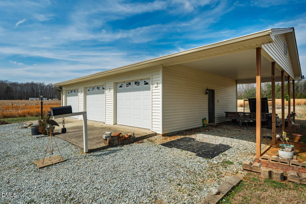200 Sawmill Road Cedar Grove, NC 27231 - Photo 44 of 72 a view of a house with backyard